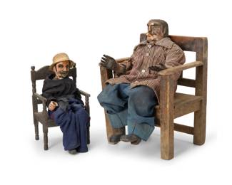 156
Early 20th century
Two Guatemalan polychrome figures of Maximón
The painted carved woof folklore figures, each with articulated limbs and dressed with later fabric clothing, depicted seated in a wood chair, one with a cigarette butt and the other with a later woven hat
2 pieces
Larger with chair: 19" H x 12.75" W x 14" D; Smaller: 14" H x 7.5" W x 10" D, dimensions variable
Estimate: $600 - $800