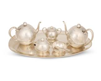 284
Mid-20th century
A Juventino Lopez Reyes sterling silver coffee and tea service
Each marked: JLR / Sterling / Made in Mexico / 925; spoon with English hallmarks
Comprising a coffee pot (7" H x 10.125" W x 5.625" D), a teapot (6.75" H x 10" W x 5.5" D), a covered cream jug (4.25" H x 5.25" W x 4" D), a covered sugar (4.24" H x 5.75" W x 4.125" D), and an open sugar (1.625" H x 4.125" Dia.), all set on an oval tray (24" W x 12.875" D), together with an associated English sterling silver spoon
7 pieces
141.9 oz. troy approximately
Estimate: $4,000 - $6,000