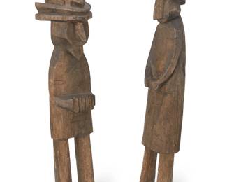 91
Early 20th century
Two Panamanian Kuna carved balsa wood figures
Comprising two aniline dyed wood figures
2 pieces
Taller: 15" H x 3" W x 2.75" D; Shorter: 13.75" H x 3.625" W x 3.75" D
Estimate: $200 - $400