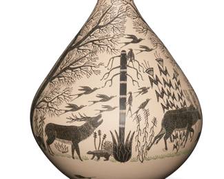 25
Hector Gallegos Jr. (b. 20th century)
A Mata Ortiz polychrome and sgraffito pottery jar, 2002; Chihuahua, Mexico
Incised signature and date to underside: Hector Gallegos Jr. 24-3-002
The wide-bodied jar with flared rim, featuring a scene painted in black and green on a white slip ground with incised details, depicting various flora and fauna among trees
9.125" H x 7.25" Dia.
Estimate: $300 - $500
