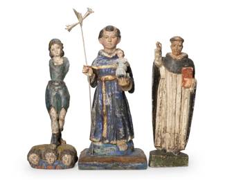 244
Early 20th century
A group of Latin American santos bultos figures
The polychrome carved wood religious figures, comprising one depicted holding the Christ child and hoisting a metal staff with floriform terminus, another figure depicted standing above three winged masks, and another figure depicted with a book
3 pieces
Largest: 20" H x 9" W x 6.5" D; Shortest: 16.25" H x 6.25" W x 4.75" D
Estimate: $300 - $500