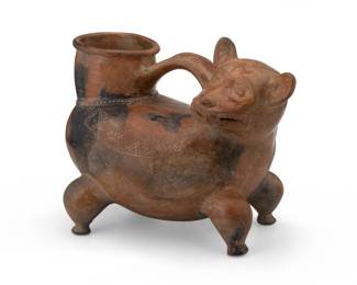 174
Circa 900 AD; Colombia
A Pre-Columbian Tairona pottery effigy vessel
The hollow-bodied ceramic mammalian figural vessel depicted bearing its teeth, with incised X-pattern details to body and central handle at top
9" H x 11.75" W x 7.5" D
Estimate: $300 - $500