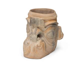 177
Circa 200 BCE; Ecuador
A Pre-Columbian Jama-Coaque pottery effigy vessel
The sculptural ceramic vessel in the form of a mythic being, with elaborate facial adornments
6.875" H x 6.875" W x 6.5" D
Estimate: $300 - $500
