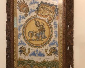 Balinese painting on fabric in carved frame (19.5” x 27”)