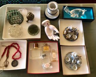 Flower frogs, Apollinaris match holder, vintage ceramic hand, Steuben songbird, miniature tea sets, perfume bottles (empty)