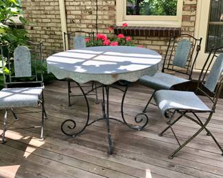 Metal patio table with galvanized top (41” diameter) with 4 matching chairs - table base & chairs fold for storage (spots on table are just shadows)