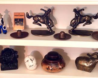 Western/cowboy collectibles: vintage figurines, bucking bronco bookends, copper cowboy hats ashtrays; Syroco flower bookends, brass elephants boxes