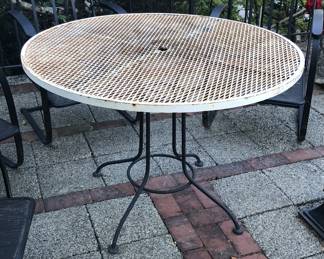 Metal patio table - 41” diameter (top is rusty)