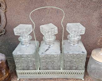 Crystal decanter set with silver holder.