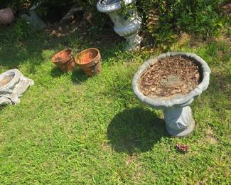 rocks, statues , concrete birdbaths and more yard art , planters etc.
