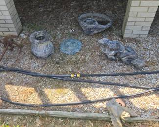 rocks, statues , concrete birdbaths and more yard art , planters etc.