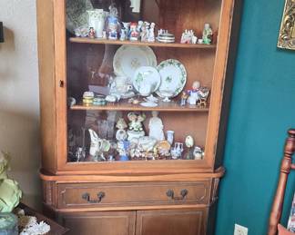 corner cabinet full of smalls and collectibles 