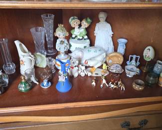 corner cabinet full of smalls and collectibles 