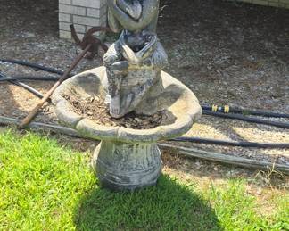 rocks, statues , concrete birdbaths and more yard art , planters etc.