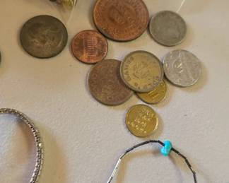 costume jewelry maybe some sterling and foreign coins 
