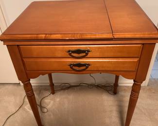 Singer sewing machine in cabinet