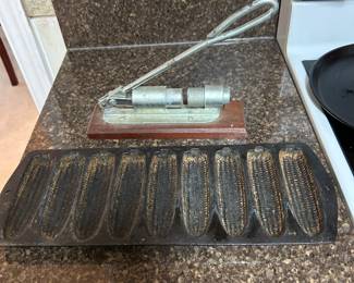Nut cracker and cast iron cornbread pan. 