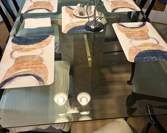 Handsome glass top breakfast table with 6 chairs.