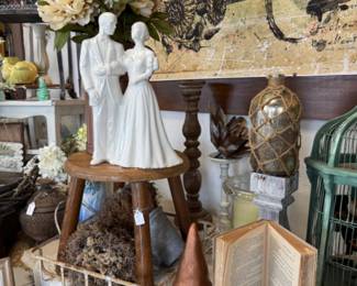 Vintage statuary, bird cage, old books, wooden stool, end tables, vintage floral stems, wooden candelsticks