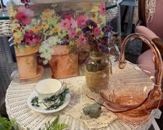 floral prints, pink glassware, white wicker furniture, 