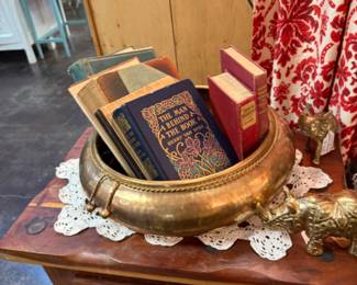 brass planter and vintage books