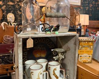 old bottles, collectible tins, deep coffee mugs, art