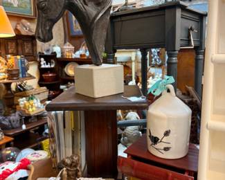 horse statuary, lamps, end tables, books, paintings