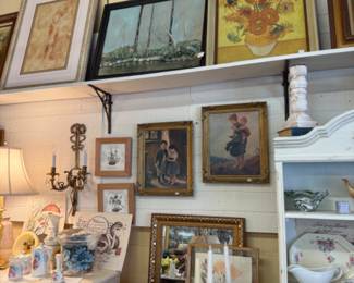 Lots of framed art pieces, candlesticks, blue and white pottery