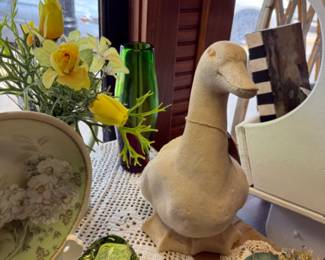 Cement duck, vintage plates, doilies
