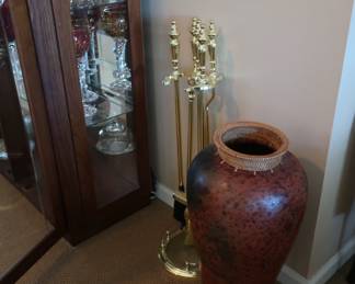fireplace tools and vase