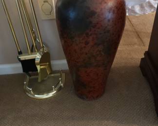 fireplace tools and vase