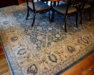 Handknotted Persian rug. Blue ground with tan border. Measures approx. 10' x 13'9"