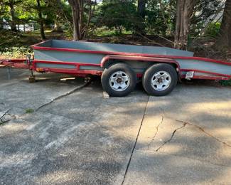 This a 16' hydraulically dumping trailer that is made out of stainless steel and aluminum