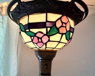 Top of Tiffany-style torchiere floor lamp