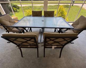 Outdoor glass top metal table and 6 chairs