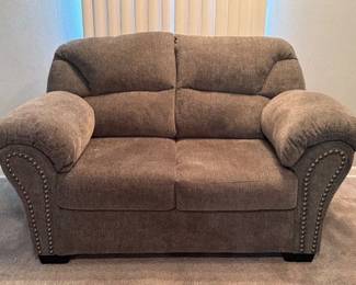 Ashley Furniture loveseat with nailhead trim, matching sofa also available