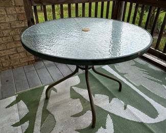 Round glass top table with hole for patio umbrella
