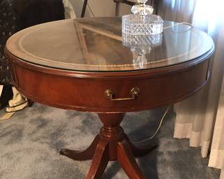 This Mahogany Finish Round Leather Inlay Drum Table Matches the Coffee Table and 2 Two Tier Step Leather Inlay End Tables. It is 29 ½ Inches in Diameter & 20 ½ Inches Tall. Leather Inlay on all 4 pieces. Custom Glass Cover. Maybe Ethan Allen Mahogany Accent Table 6686 or 9899 (Drum Table) $135