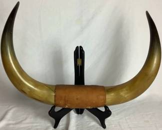 Vintage Pair of Aged Patina Bull Horns Joined by a Leather Piece in the Center