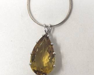 Sterling silver necklace with sterling and topaz pendant. Chain marked Italy