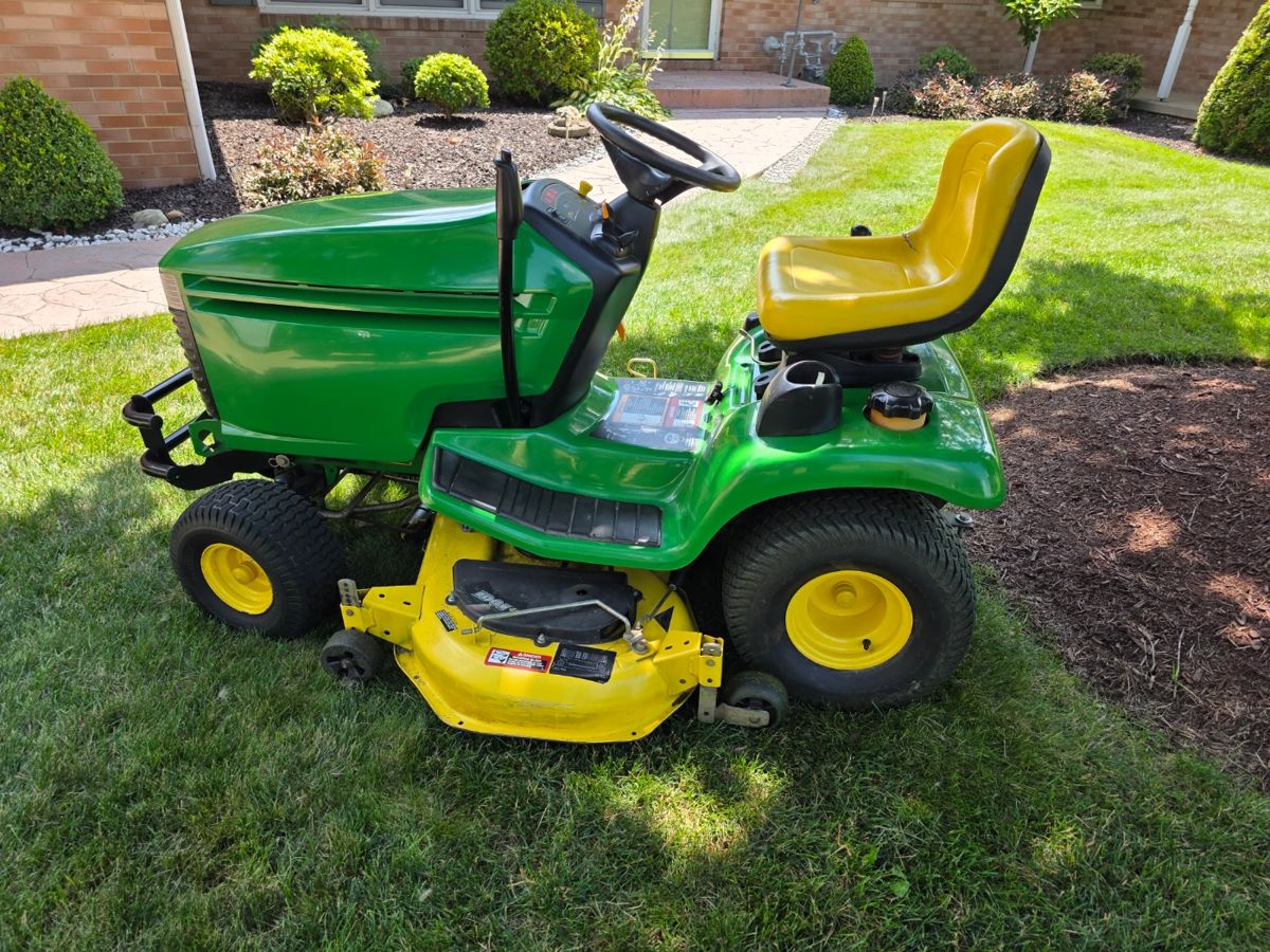 John Deere LX279, 17Hp engine, mulching attachment, 48" mowing deck, 1100 hours. Looks and runs like it's brand new! Extra blades and belts go with the mower as well. 