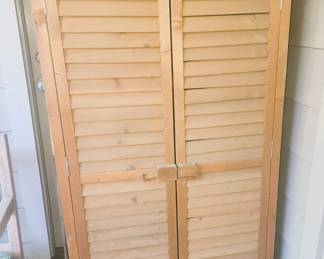 Wood storage cabinet
