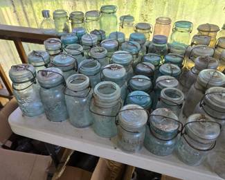 Hundreds of vintage and antique Mason jars, all kinds