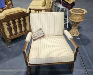 Oversized wood frame chair.