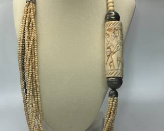 Unique Nine (9) strand Necklace with Beautiful Elephant Carving - MUST SEE!
Beads 4mm to 8mm with 3" tubular elephant carving. Necklace 26" in length.
USA Shipping Only.