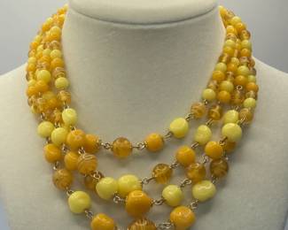 Enjoy the Look of this beautiful four (4) strand Necklace with Yellow & Gold Beads!
Measures approximately 14". Decorative clasp.
USA Shipping Only.