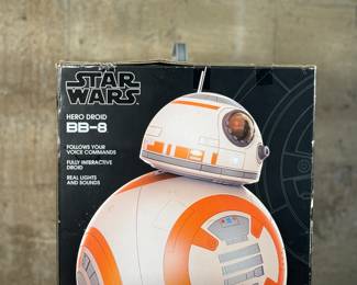 This lot features a new in box, Star Wars Hero Droid BB-8 fully interactive droid. Hero Droid BB-8 comes to life with an impressive height of over 16 inches (19 inches with antenna), voice and sound responses, and a motion sensor. Enjoy full control of your BB-8 with multiple voice commands, 360-degree remote control movement, and unique Follow Me mode which allows Hero Droid BB-8 to roll along beside you just like in the film!
