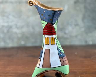 This lot features a stunning handmade flower pottery vase by Gappa in the town of Goole in the UK. Measures, 9” H x 4” W x 3.5” D. Maker mark present underneath as shown in photos.
