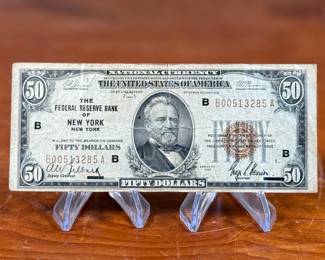 This lot features a 1929 $50 Federal Reserve Bank Note from the Federal Reserve Bank of New York. 
