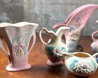 This lot features seven pieces of antique Hull pottery in very good condition. The tallest piece measures 8.5” H x 9” W x 3” D. Hull pottery began production in 1905 in Crooksville, Ohio, under the leadership of Addis Emmet (A.E.) Hull. The Hull Pottery Company’s early lines consisted of common utilitarian stoneware, semi-porcelain dinnerware and decorative tile.
